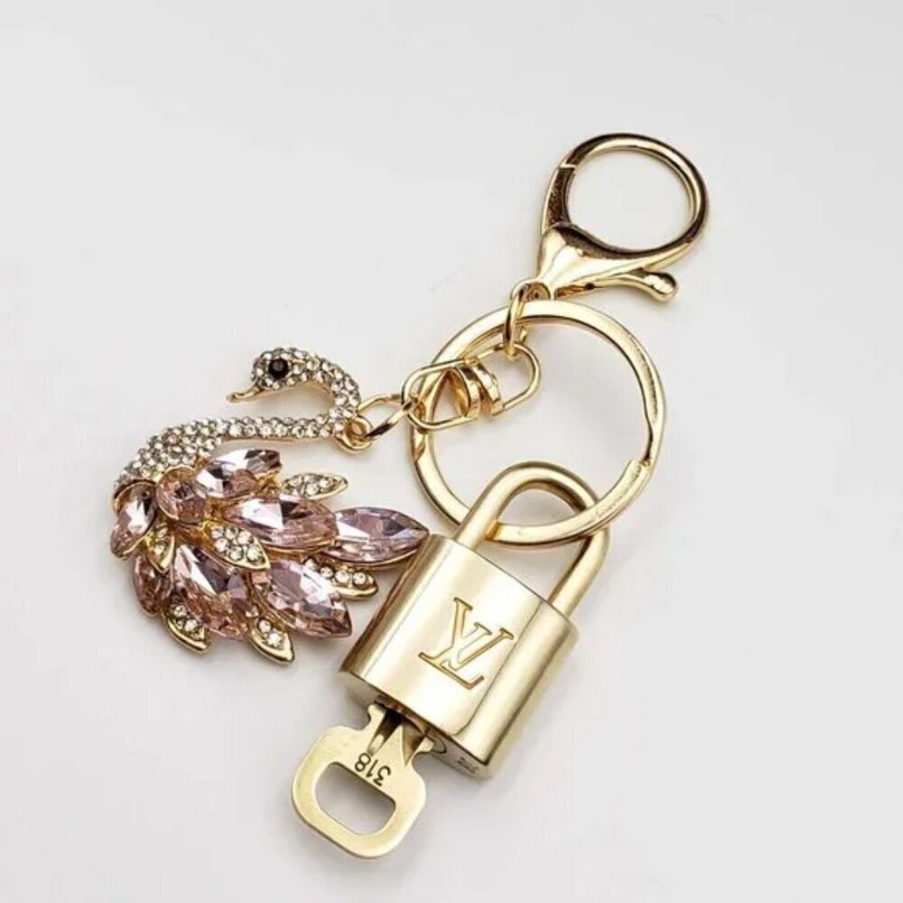 Louis Vuitton Gold Padlock Key 🔒 Authentic LV Charm + Unbranded Swan Keychain - Picture 2 of 8